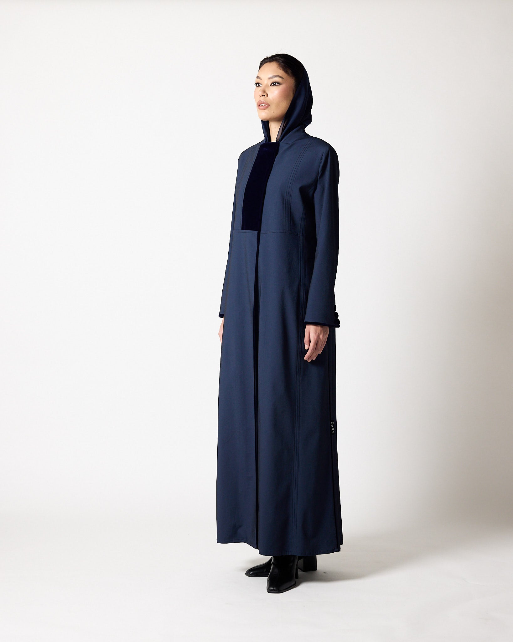 A model wearing a long, dark navy blue hooded abaya with a contrasting black front panel, styled with a black inner top and black shoes, standing against a plain white studio background.عبايات قطر | Abaya Qatar
عبايات الدوحة | Abayas Doha
عباية قطر | Abaya Doha
عبايات اونلاين قطر | Abayas Online Qatar
عبايات أونلاين قطر | Online Abayas Qatar
شراء عبايات قطر | Buy Abaya Qatar
شراء عبايات اونلاين | Buy Abayas Online
متجر عبايات قطر | Abaya Store Qatar
محل عبايات قطر | Abaya Shop Qatar
بوتيك عبايات قطر | Abaya